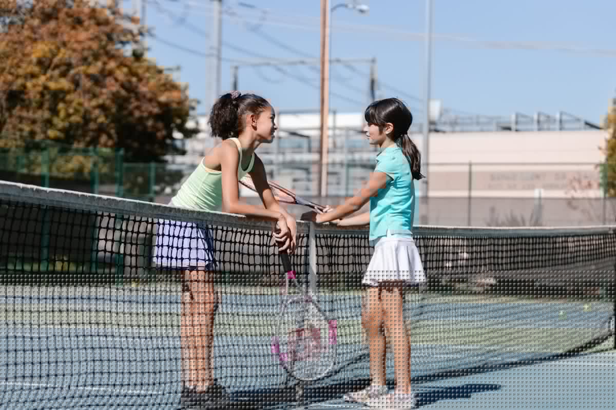 Pickleball player ready to serve on an indoor court